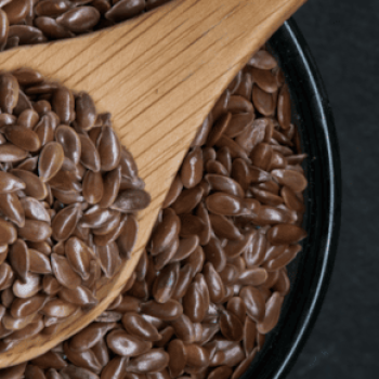 flaxseeds in a bowl with a spoon