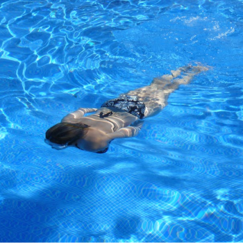 woman swimming underwater